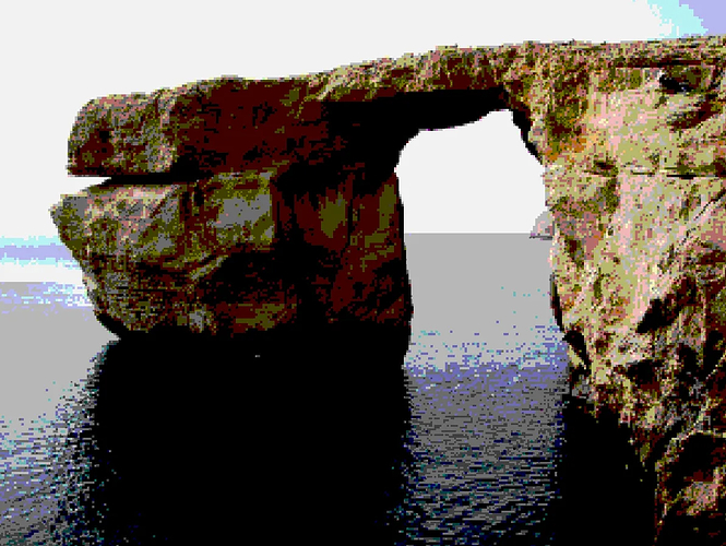 A clifftop rendered with a low-colour count palette in a pixelated style. It features an enormous sea arch above clear still blue water.