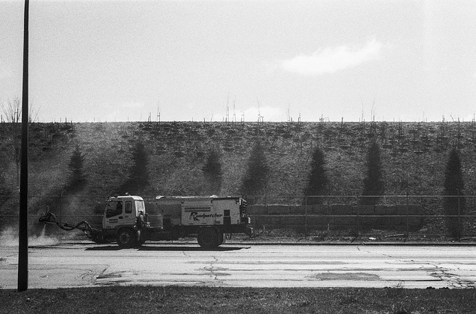 a road resurfacing machine fixing a pothole