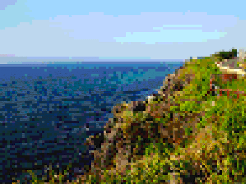 The same grassy clifftop, but this time subjected to intense pixelisation resulting in an unpleasant riot of colour.